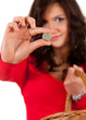young woman with money, euro coin, focus on foreground