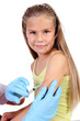 Doctor doing vaccine injection to child