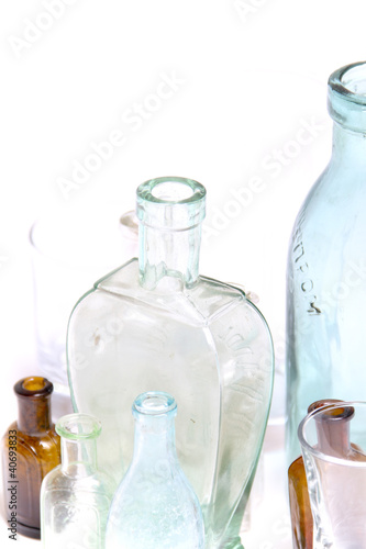 Photo: Vintage glass bottles on white Vintage glass bottles on white