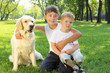 Photo: Two brothers in the park with a dog Two brothers in the park with a dog
