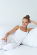 Relaxed beautiful woman sitting on couch