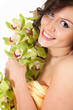 beautiful young woman with orchid flowers