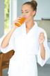 Photo: Woman enjoying a glass of orange juice Woman enjoying a glass of orange juice