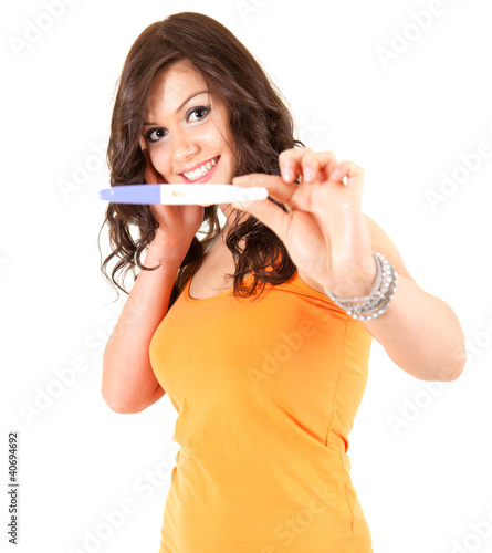 Photo: happy young woman and positive pregnancy test happy young woman and positive pregnancy test