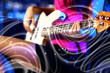 Young guitar player performing in night club