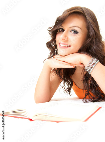 Photo: happy student young woman with book looking at camera happy student young woman with book looking at camera