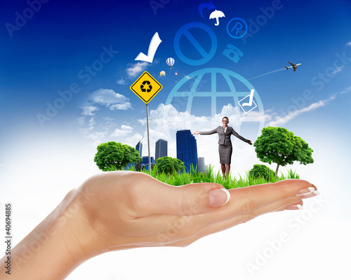Illustration: Human hand holding a green landscape Human hand holding a green landscape
