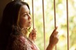 sad woman looking at windows