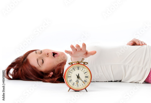 Photo: a woman's hand presses the button of clock a woman's hand presses the button of clock