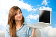 Photo: Young woman showing laptop. Young woman showing laptop.