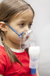 Photo: little girl with nebulizer little girl with nebulizer