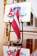 The national flag and Coat of arms of Latvia
