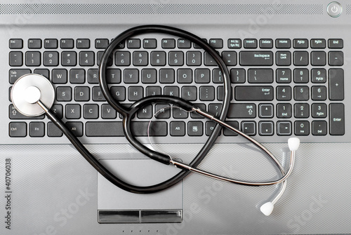 Photo: Computer with stethoscope on it Computer with stethoscope on it