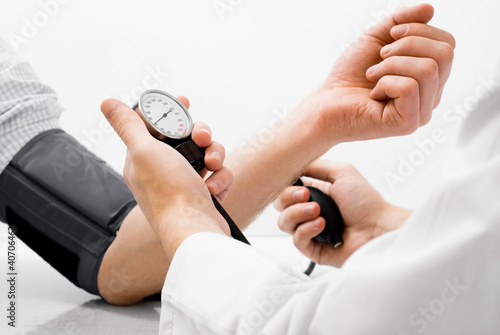 Photo: Blood pressure measuring studio shot Blood pressure measuring studio shot