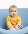 surprised baby with a yellow shirt