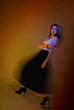 Beautiful girl posing in front of colored creative lighting Beautiful girl posing in front of colored creative lighting