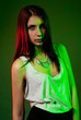 Beautiful girl posing in front of colored creative lighting Beautiful girl posing in front of colored creative lighting