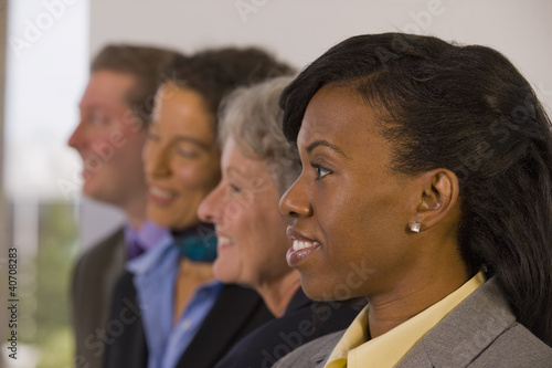 Photo: Hispanic businesswoman smiling with her colleagues Hispanic businesswoman smiling with her colleagues
