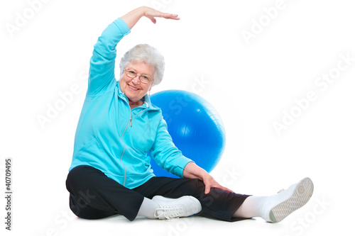 Photo: senior woman doing stretching exercises senior woman doing stretching exercises