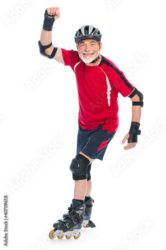 Foto: senior man inline skating senior man inline skating