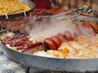 Cooking food - grilled mutton, sausages with vegetables
