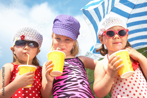 Photo: Cute children with soft drinks Cute children with soft drinks