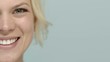 Young beautiful female teen smiling at camera, cropped view