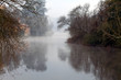Foggy river with watemill
