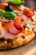 Pizza with Salami, Ham and Mushrooms