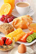 Breakfast with coffee, rolls, egg, orange juice, muesli and chee
