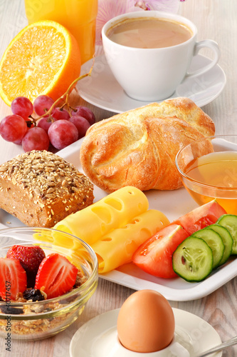 Photo: Breakfast with coffee, rolls, egg, orange juice, muesli and chee Breakfast with coffee, rolls, egg, orange juice, muesli and chee
