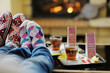 Young romantic couple relaxing in front of fireplace at home