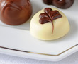 Belgian chocolates on silver lined plate, shallow dof Belgian chocolates on silver lined plate, shallow dof