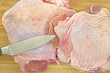 Turkey thighs on cutting board