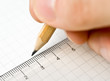 Writing. An hand who writes in a paper sheet with a pencil Writing. An hand who writes in a paper sheet with a pencil