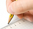 Writing. An hand who writes in a paper sheet with a pencil Writing. An hand who writes in a paper sheet with a pencil