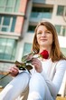 Gift - young woman with red rose Gift - young woman with red rose