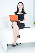 Business woman using laptop sitting on the table