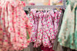 Stands with clothes in kids mall