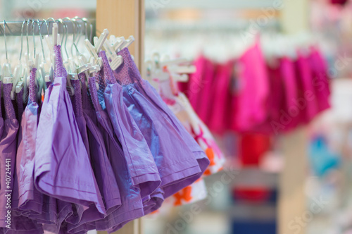 Photo: Stands with clothes in kids mall Stands with clothes in kids mall