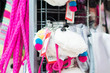 Variety of handbags on stand in mall