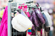 Variety of handbags on stand in mall