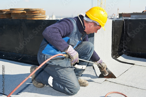 Photo: Flat roof covering works with roofing felt Flat roof covering works with roofing felt