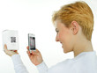 Woman scans a scancode with her cellphone