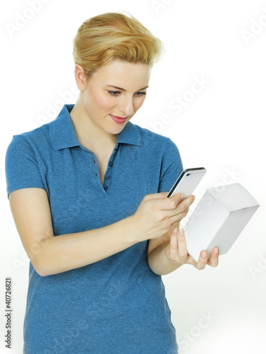 Photo: Pretty woman scans a scancode with her cellphone Pretty woman scans a scancode with her cellphone