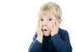 portrait of a boy with a surprised expression on his face