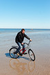 Cyclist at sea.