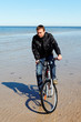 Cyclist at sea.