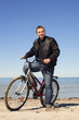 Cyclist at sea.