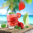 Strawberry cocktail on a beach